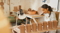 Female Potter Working At Pottery Wheel In Ceramics Studio - PhotoDune Item for Sale