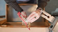 Overhead Shot Of Female Jeweller Working On Piece With Saw In Studio - PhotoDune Item for Sale