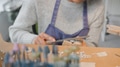 Close Up Of Female Jeweller Working On Ring With File In Studio - PhotoDune Item for Sale