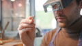 Close Up Of Male Jeweller Looking At Ring Through Headband Magnifiers In Studio - PhotoDune Item for Sale