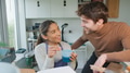 Couple Running Bespoke Jewellery Business Discussing Design During Coffee Break In Studio - PhotoDune Item for Sale