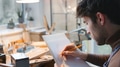 Male Jeweller At Workbench Sketching Out Design For Ring In Studio - PhotoDune Item for Sale