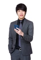 Asian Young businessman use of the mobile phone - PhotoDune Item for Sale