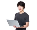 Asian Man use of notebook computer - PhotoDune Item for Sale
