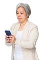 Retired woman read on smartphone - PhotoDune Item for Sale