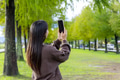 Tourist woman use mobile phone to take photo in countryside - PhotoDune Item for Sale