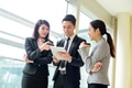 Group of business people discuss on tablet - PhotoDune Item for Sale
