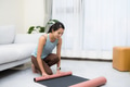 Sport woman tidy up yoga mat home - PhotoDune Item for Sale