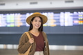Woman traveler waiting at airport terminal - PhotoDune Item for Sale
