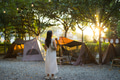 Woman relaxing at campsite during peaceful evening time - PhotoDune Item for Sale