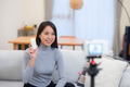 Woman influencer promoting beauty product in front camera - PhotoDune Item for Sale