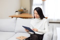 Woman using digital tablet computer working at home - PhotoDune Item for Sale
