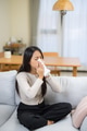 Young woman holding tissue with runny nose - PhotoDune Item for Sale