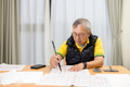 Asian old man practice Chinese characters with calligraphy at home - PhotoDune Item for Sale