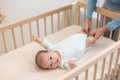 Asian mom help baby to do exercise for releasing gas from tummy - PhotoDune Item for Sale