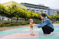Mother help baby boy walk in park - PhotoDune Item for Sale