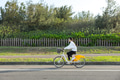 Woman riding bicycle outdoors on sunny day park - PhotoDune Item for Sale