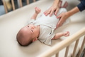 Mum massage on baby tummy at home - PhotoDune Item for Sale