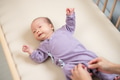 Mum help newborn baby to change clothes - PhotoDune Item for Sale