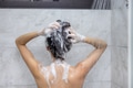 Woman washing her hair with shampoo in shower - PhotoDune Item for Sale