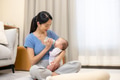 Mother feeding baby with bottle - PhotoDune Item for Sale