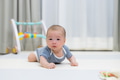 Little newborn baby learning to crawl indoor - PhotoDune Item for Sale