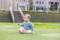 Little baby boy sit on the grass - PhotoDune Item for Sale