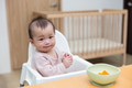 Cute baby tasting carrot first solid food - PhotoDune Item for Sale