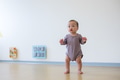 Asian baby standing and playing inside playhouse - PhotoDune Item for Sale