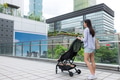 Mother walk with her baby on stroller in city - PhotoDune Item for Sale