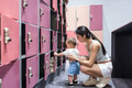 Mother store bag at locker with baby - PhotoDune Item for Sale