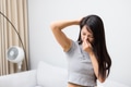 Woman worried about armpit sweat and smell during hot day - PhotoDune Item for Sale