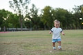 Happy baby running freely on green grass - PhotoDune Item for Sale