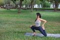 Woman practicing yoga outdoors in park environment - PhotoDune Item for Sale