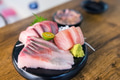 Fresh Japanese sashimi slices served on traditional plate - PhotoDune Item for Sale