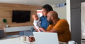 African American Family With Baby Daughter Using Laptop To Check Finances At Home - PhotoDune Item for Sale