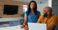 African American Couple Using Laptop To Check Finances At Home - PhotoDune Item for Sale