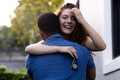 Young couple embracing outdoors, woman smiling joyfully while holding keys - PhotoDune Item for Sale