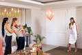 Women celebrating at home with balloons and cake, enjoying joyful moments together - PhotoDune Item for Sale