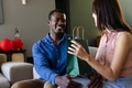 At home, couple exchanging gift bag, celebrating and sharing joyful moment together - PhotoDune Item for Sale