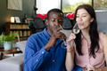 Couple enjoying wine together at home, celebrating with joyful expressions - PhotoDune Item for Sale