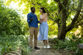 Couple walking in garden, laughing and enjoying sunny day together - PhotoDune Item for Sale