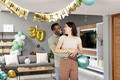 African American man and woman celebrating birthday at home, smiling and embracing - PhotoDune Item for Sale