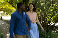 Couple walking in park, enjoying sunny day and each other's company - PhotoDune Item for Sale
