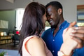 Couple dancing closely at home, sharing joyful smiles and intimate connection - PhotoDune Item for Sale