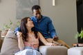 Couple relaxing on sofa at home, enjoying quality time together - PhotoDune Item for Sale