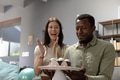 Celebrating birthday, happy couple enjoying cake with candles at home - PhotoDune Item for Sale