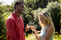 Couple celebrating outdoors, toasting with champagne glasses in sunny garden - PhotoDune Item for Sale