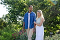 Couple walking in garden, enjoying nature and each other's company on sunny day - PhotoDune Item for Sale