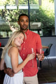 Couple celebrating at home, holding champagne glasses and smiling warmly - PhotoDune Item for Sale